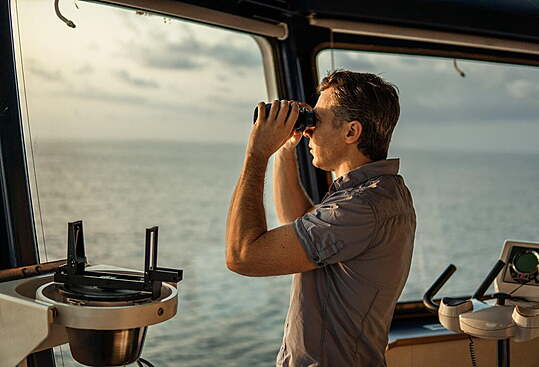 Ship's captain looking out to the future to identify target location.